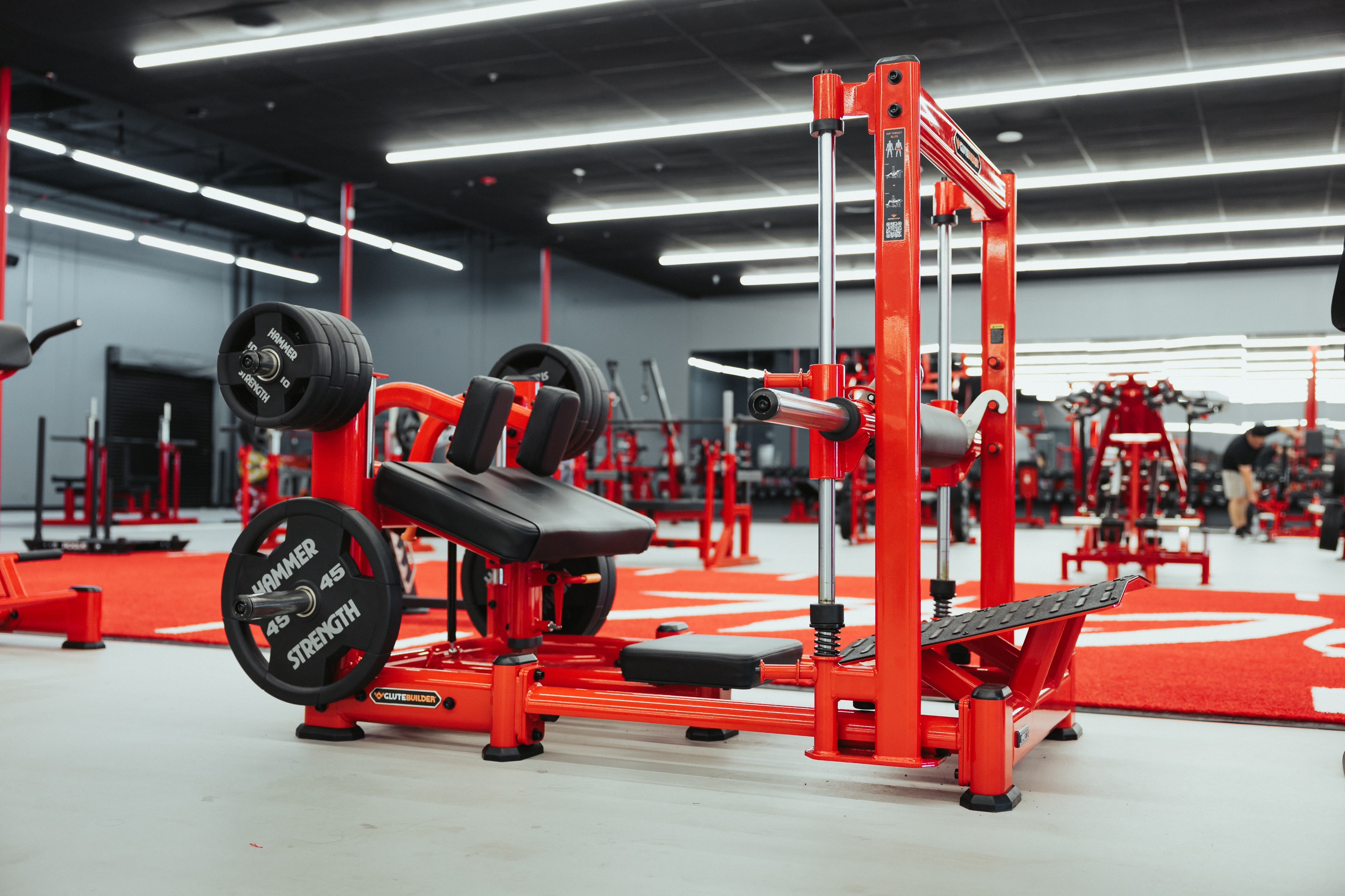 Glute builder and hip thrust station on the red turf at Camarillo